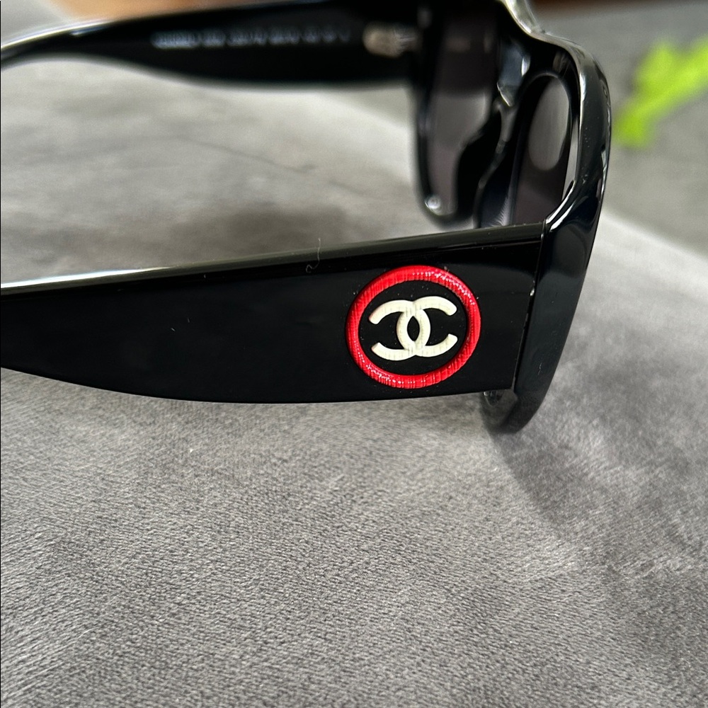 CHANEL Black Sunglasses with Red and Gold CC Logo